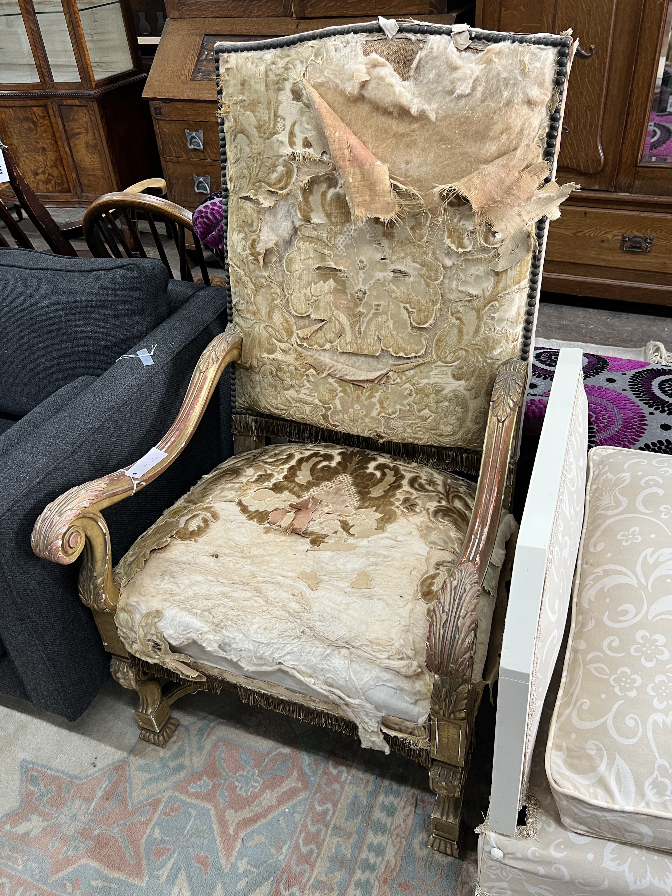 A Louis XIV style carved giltwood armchair, width 66cm, depth 64cm, height 118cm